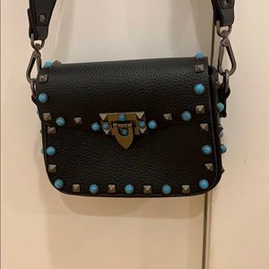 black purse with colorful strap NEVER USED!